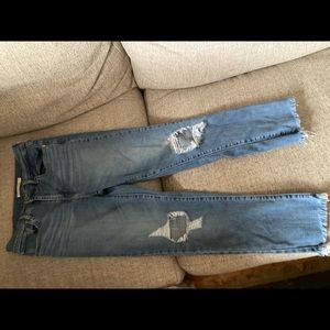 Levis size 27 waist (size 4 equivalent) ripped knee jeans.